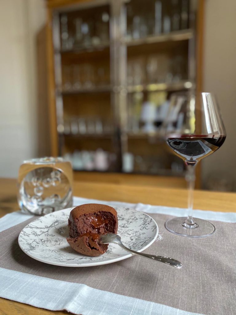 Chocolate fondant with a glass of red wine